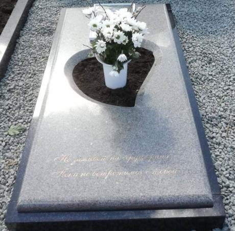 Granite gravestone with a heart-shaped cutout 